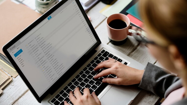 woman looks up her e-mails