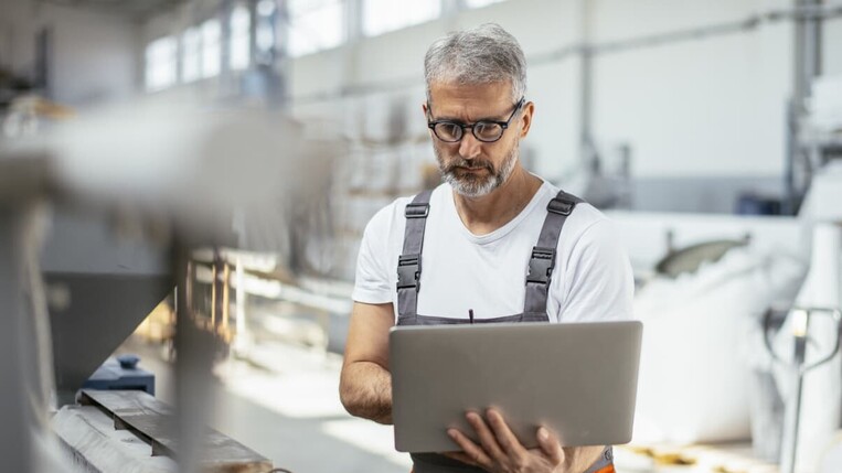 Man with laptop in the prodcution